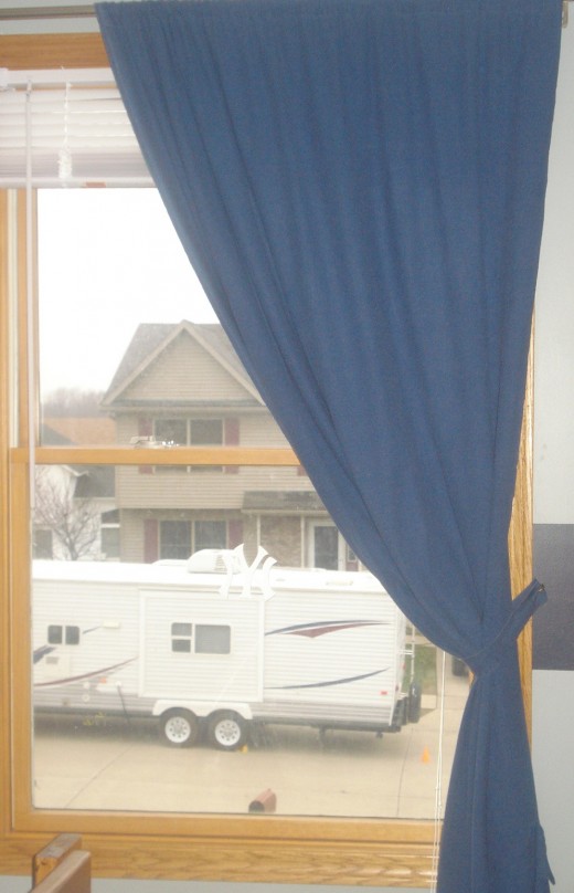 Thrift store sheet = curtains for my little man's blue room.  No, that RV does not live outside my house - the neighbors are going camping!