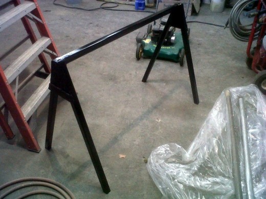 I had a a little extra time today to finish up that last saw horse.  I welded up the end caps and put a nice coat of gloss black paint over it.