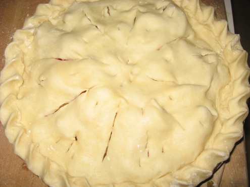Cut holes in the crust to allow steam to escape while the pie bakes.