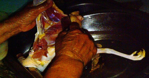 Mother  literally divided the chicken into two. What a strong hands she have.