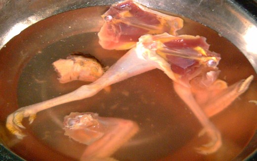 Cutting chicken parts, from neck, breast, legs, etc.