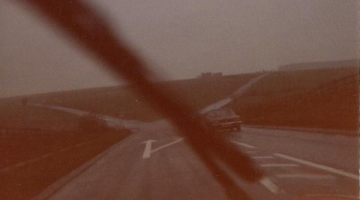 The dark mass just above the car ahead is Stonehenge
