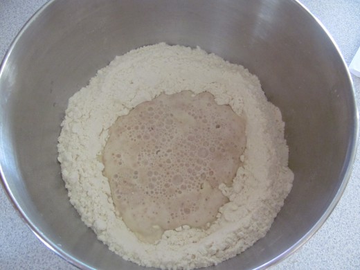 Yeast will bubble up (bloom) after a few minutes of being added to the water if it is good...if it does not begin to bloom, your water was too hot or your yeast is too old.