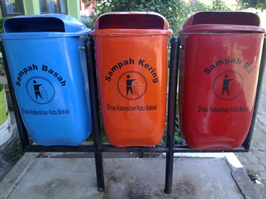 Rubbish bins are painted in different colors to help people classify garbage they dump. It will also help the next process for recycling.