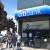 CitiBank on 2 Mott Street. This is a great place to meet. There are ATMs for cash too since many of the restaurants and souvenir shops do not accept credit cards.