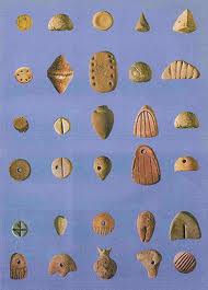 Image of utility "tokens for early writing." From Token communication we have evolved into an advanced script writing society.