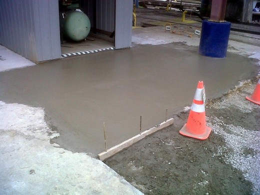 Randy and I beat the storm and poured about 2.5 yards of concrete today.