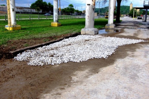 I had a couple of hours by myself at work, so I decided to dress up this former mud hole with old rail ties and gravel.