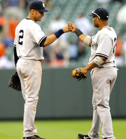 Both middle infielders Derek Jeter (left) and Robinson Cano (right) celebrate the Yankees 6-3 win over the Baltimore Orioles.