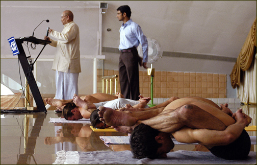 Sri K. Pattabhi Jois' demonstrating Ashtanga Yoga to the large audience. Also check the youtube video.
