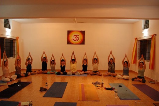 To be yoga teachers performing Padma Parvatasana in Shala Yoga Institute Mysore