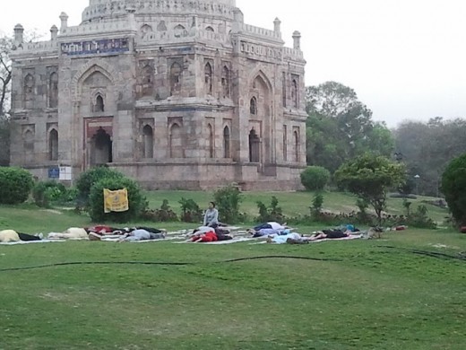 Several students learning yoga in the early morning hours at Lodhi Garden in New Delhi. According to me, learning Yoga in a garden or park is much better than learning inside the room. Might be possible as I am nature lover.