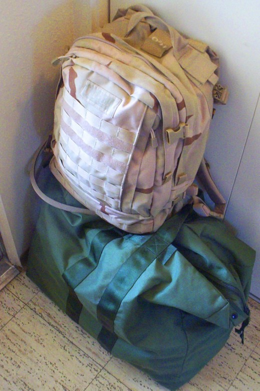 Duffel bags packed and waiting by the door is a sign the day of deployment is fast approaching.