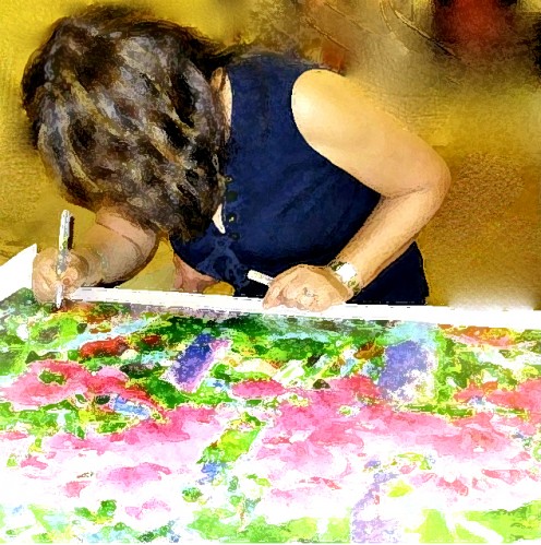 Artist signing artwork "Bougainvilleas" on Giclee