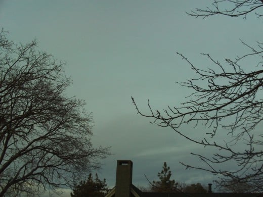 A chimney and the gray sky of winter.