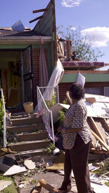 Geraldine Winchester surveys the damage to her Smithfield Estates home in Birmingham, Ala., on Thursday, April 28, 2011, which was her 70th birthday. The roof collapsed on Winchester and her husband on Wednesday night, April 27, 2011, and she escaped