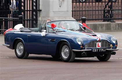 Just married: Prince William and the former Kate Middleton take a ride and wave to the crowds in a vintage Aston Martin