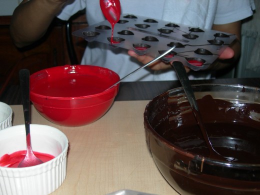 tempered unsweetened chocolate and melted flavored chocolate for molding and filling.