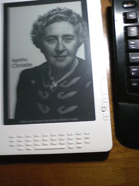 Kindle DX in Sleep Mode Offers Portraits of Famous Writers and Images of Important Books.