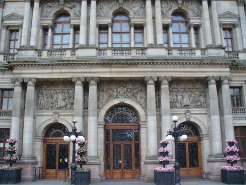 The City Chambers' grandiose balcony and main doorway, designed by William Young and completed in 1888 