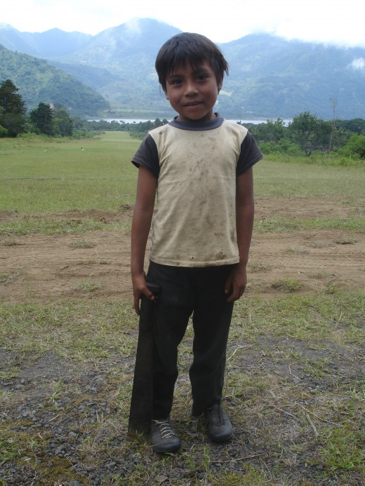 Notice this little one holding a machete.  Children are taught to use them as early as 4 years old.