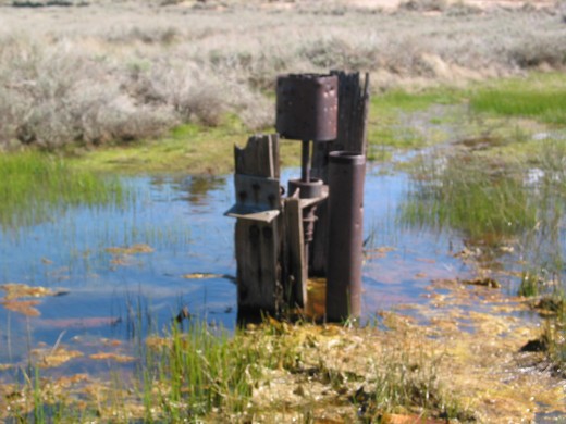 a rusted pioneer's pump where miner's drew water from underground springs; Holcombe Valley, California.