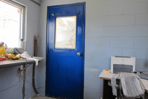 Boredom struck again today at work, so I grabbed a bucket of paint and a brush and went to work painting this door.