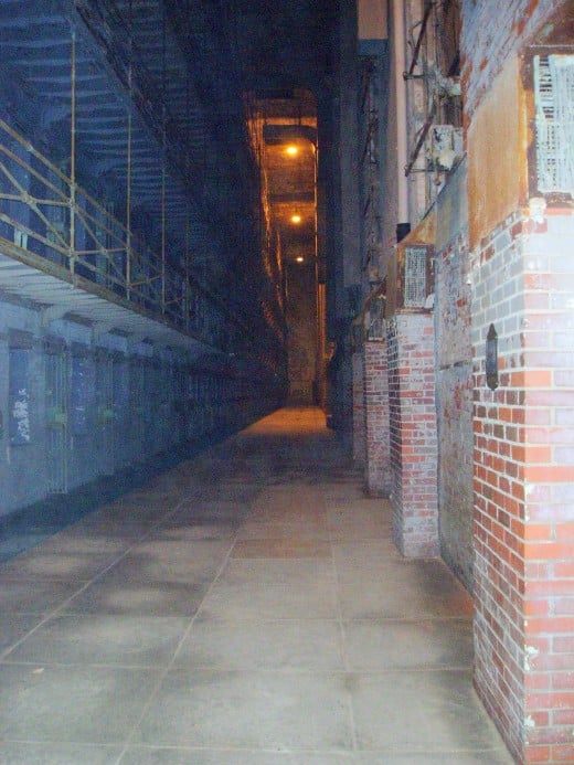 View from first floor of jail area. The cells are to the left, the brick fireplaces are on the right.