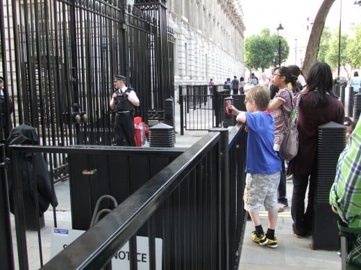 My son taking photos of Downing Street through the gates