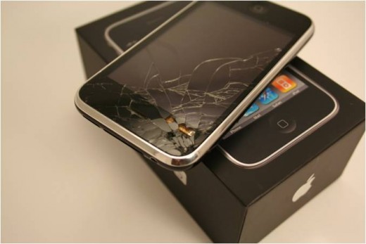 Severe cracking in the upper portion of the screen has caused pieces of the glass to chip off. The upper portion of the digitizer has been exposed (orange)