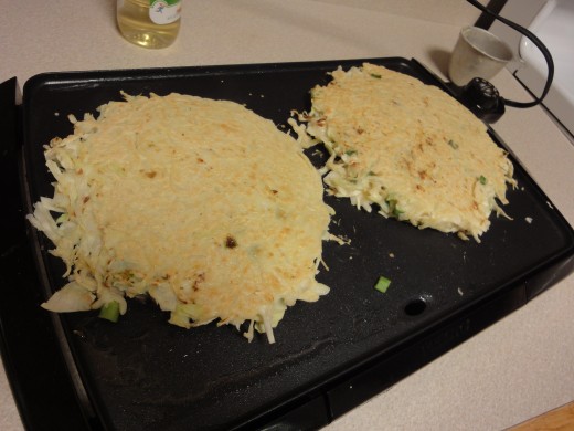 okonomiyaki "pancakes" flipped once 