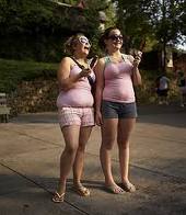 Overwieght Teenagers Enjoying Ice Cream