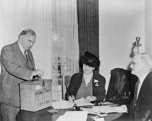 Rt. Hon. W.L. Mackenzie King voting in the plebiscite on the introduction of conscription for overseas military service, 1942