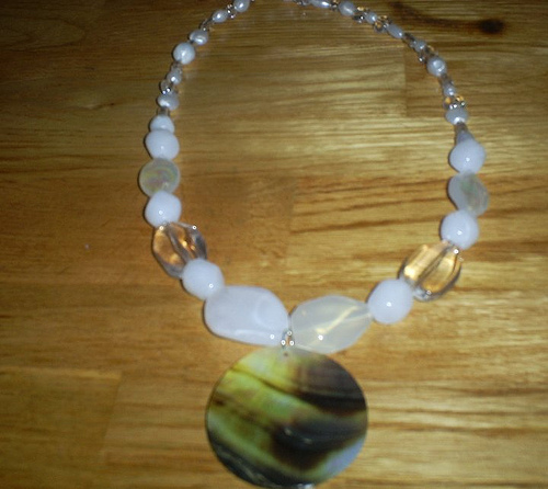 Here is what the final necklace looks like.  I made this necklace using white acrylic beads, beading wire, and a shell.