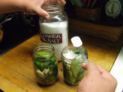 Add 1/4 to 1/2 teaspoon Salt to a Pint Jar and 1 teaspoon of Salt to a Quart Jar.