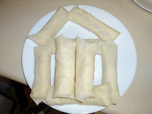 Plate of ready for frying banana lumpias