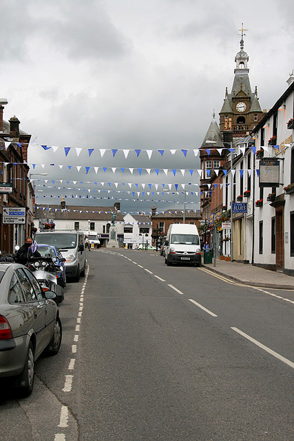 Lockerbie High Street. The town hall clock tower is prominent on the right.