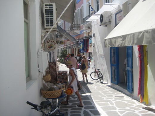 A small street in Paros with little shops.