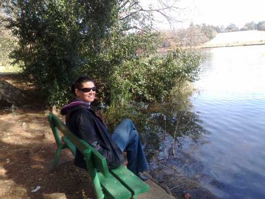 My wife Cavell sitting at Emmerentia dam, Johannesburg.
