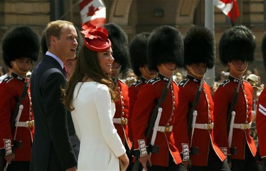 The Duke and Duchess observe the march past of the Governor General Foot Guards after they arrive for Canada Day festivities on Parliament Hill