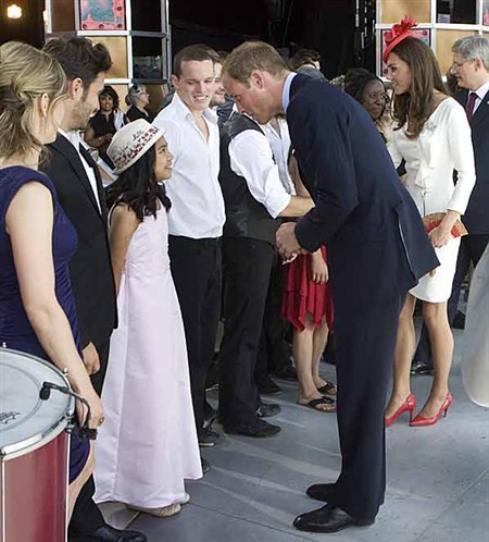 Prince William chats with Maria Aragon who sang the Canadian national anthem following the Canada Day performance. Maria, the young Winnipeg YouTube sensation had a chance to sing with Lady Gaga during a recent show in Toronto. 