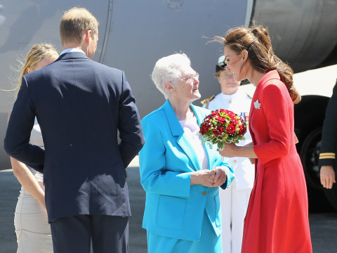 81 year old Frances Miller's (in blue) royal dream came true 72 years late. She almost had a chance to meet King George and Queen Elizabeth in 1939, but the plans didn't pan out for the nine year old girl. She presents flowers to the Duchess.