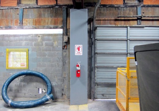 Out of boredom, I painted this post gray and hung up a Fire Extinguisher sign, just in case someone couldn't easily identify that big red bottle (thanks OSHA).