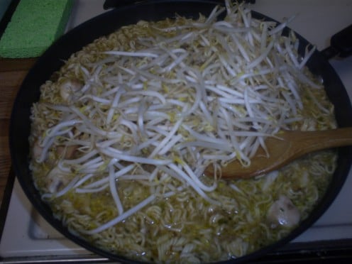 Add an entire bag of bean sprouts to the pan.