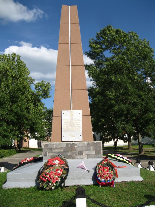 Memorial located across Volkhov River opposite Kremlin in Veliky Novgorod, Russia.  Memorial honors 3 men who gave their lives in Great Patriotic War (WW II) by throwing  themselves at German tanks or artillery and temporarily halting Nazi advance.