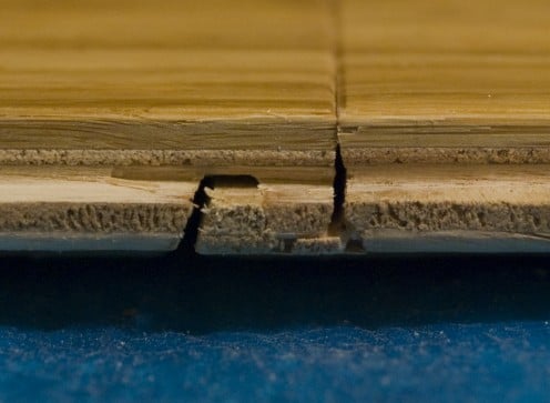 The short edge of the Bamboo Flooring is overlapped. As you may see from the picture, the precision milling holds the boards tightly together preventing gaps.