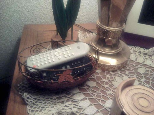 A small basket is perfect for controlling those remotes!