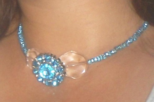 Make this beautiful necklace with beading wire, a button, and seed beads. 