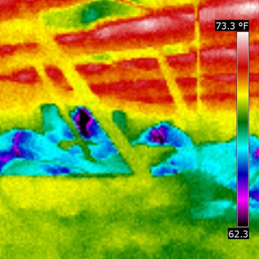 View of the ductwork leakage and how condensation is forming on the framing of the ceiling due to excess temperature differencial.