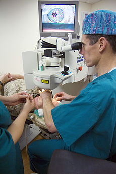 LASIK Surgeon Performing Capt. Joseph Pasternak, an ophthalmology surgeon at National Naval Medical Center Bethesda, lines up the laser on Marine Corps Lt. Col. Lawrence Ryder's eye before beginning LASIK VISX surgery.  BETHESDA, Md. (May 1, 2007) - 